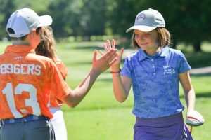 Junior golfers on golf course